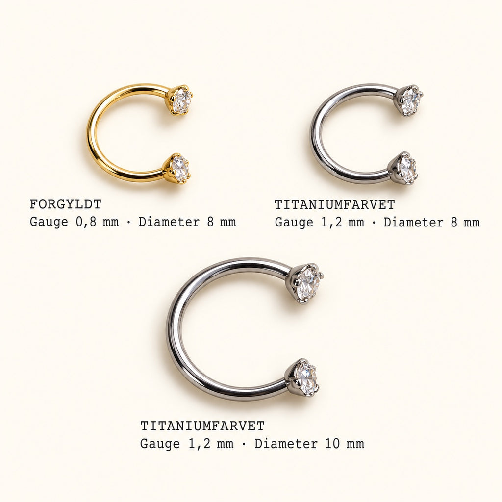 Ayla hestesko piercing – størrelser: forgyldt 0,8 × 8 mm, titanium 1,2 × 8 mm og 1,2 × 10 mm